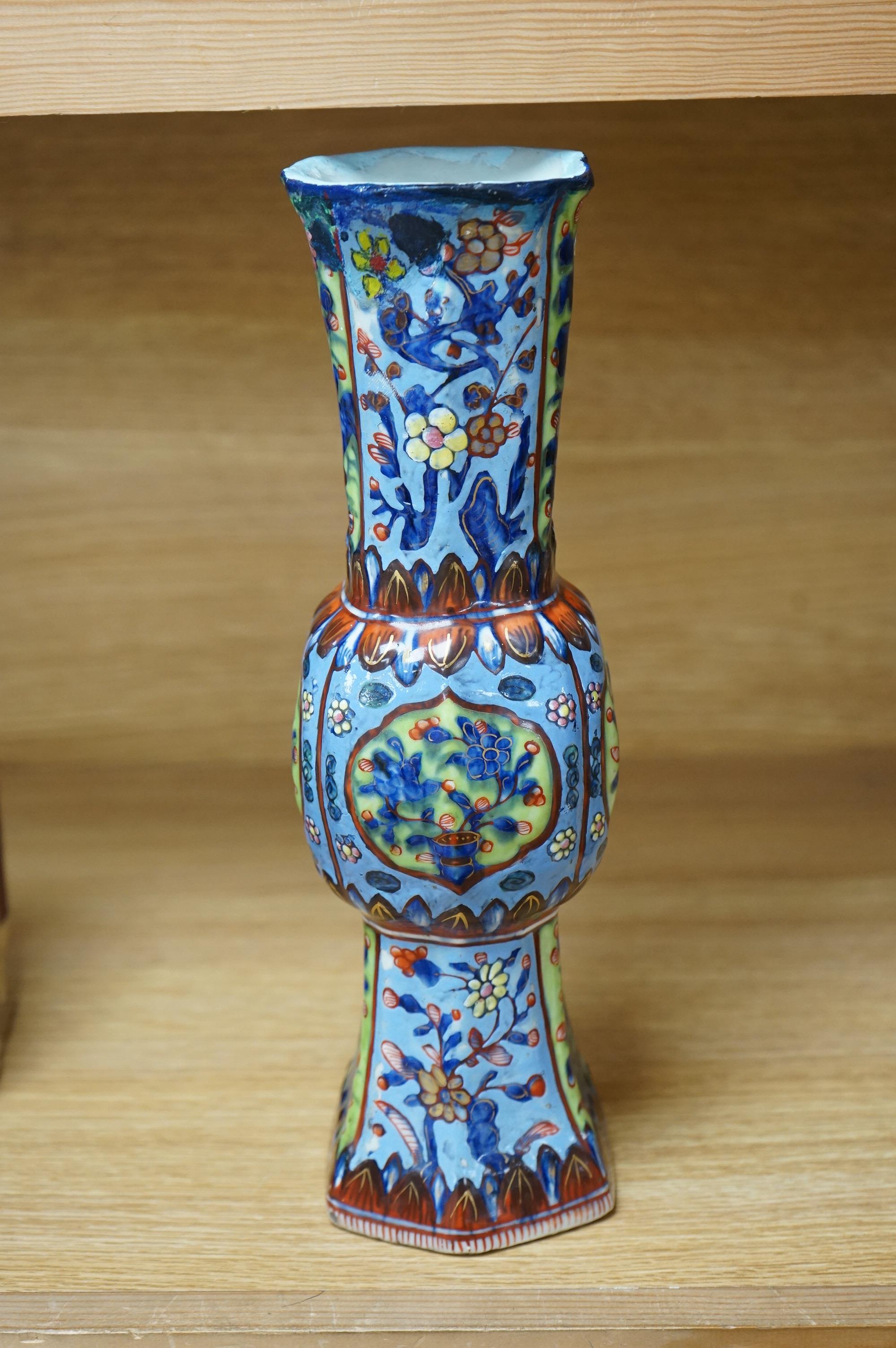 A Chinese clobbered Gu shaped vase, 30cm high. Condition - restored